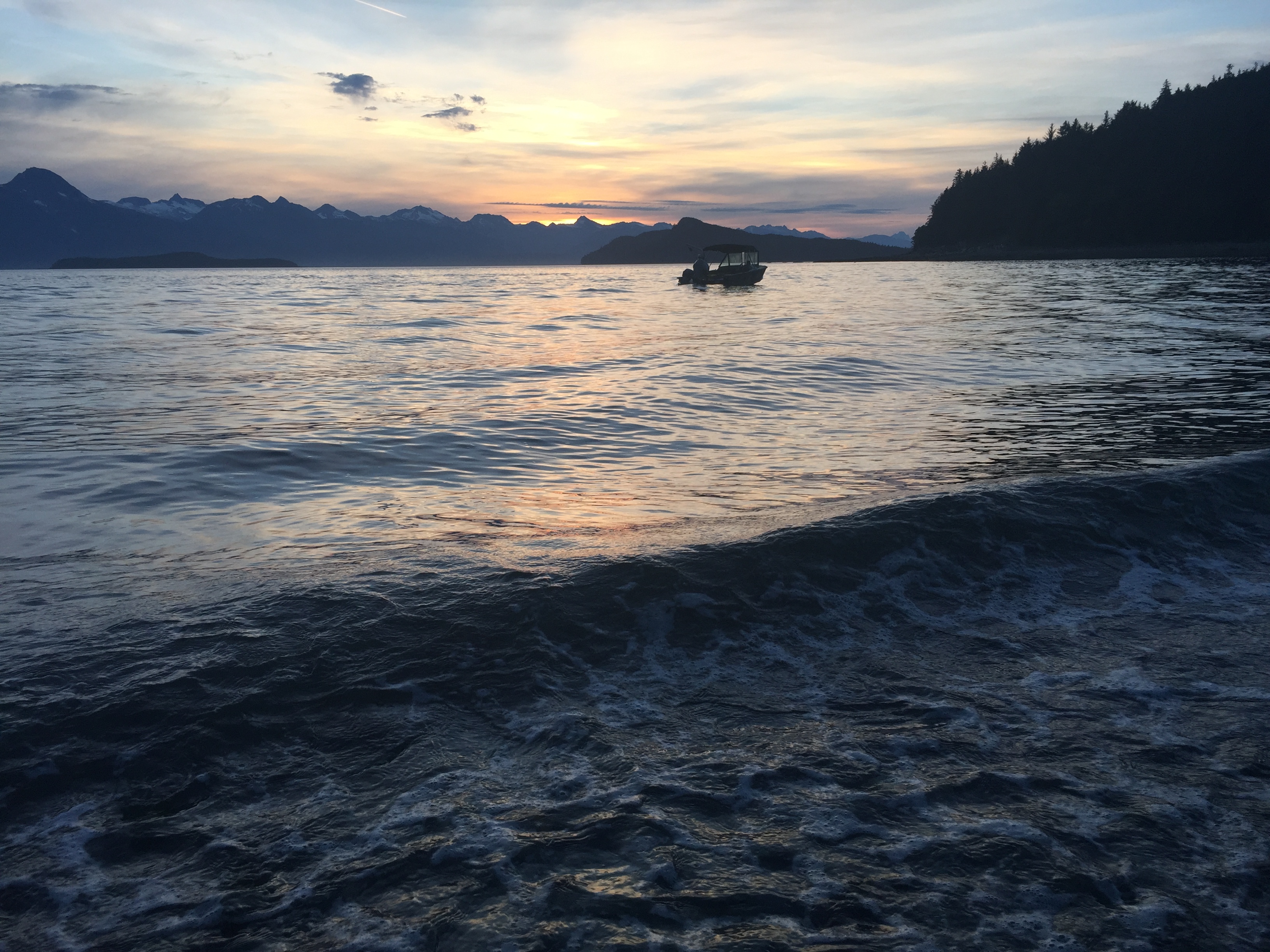 Footloose anchored at Handtroller Cove-Southeast Alaska. Chilkat Range in background.